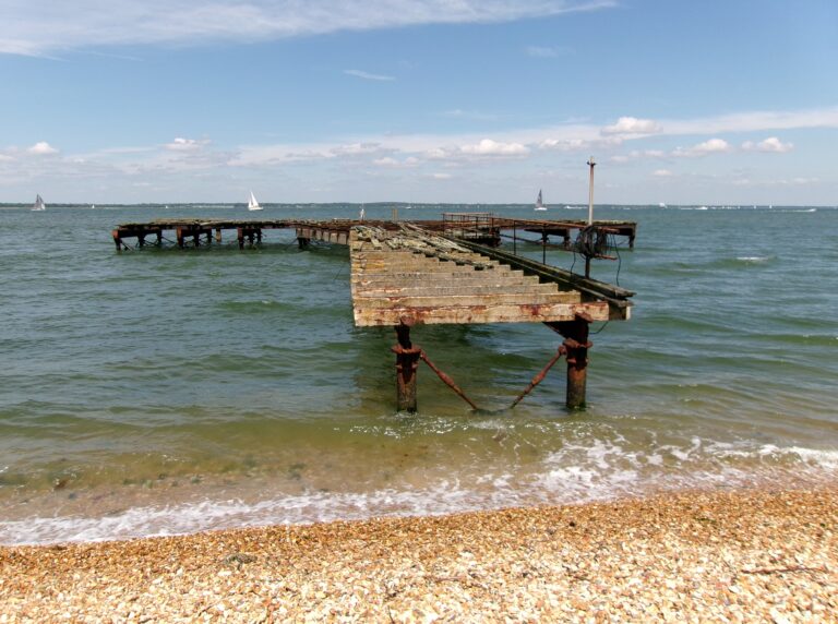 Derelict pier at Fort Victoria on the Solent, seen from the shingle beach.