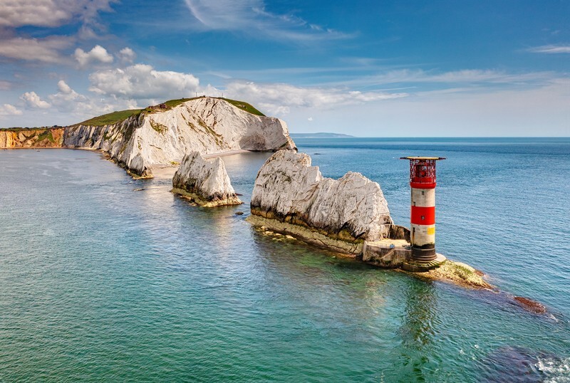 Aerial view of The Needles chalk stacks and lighthouse off the Isle of Wight coast.